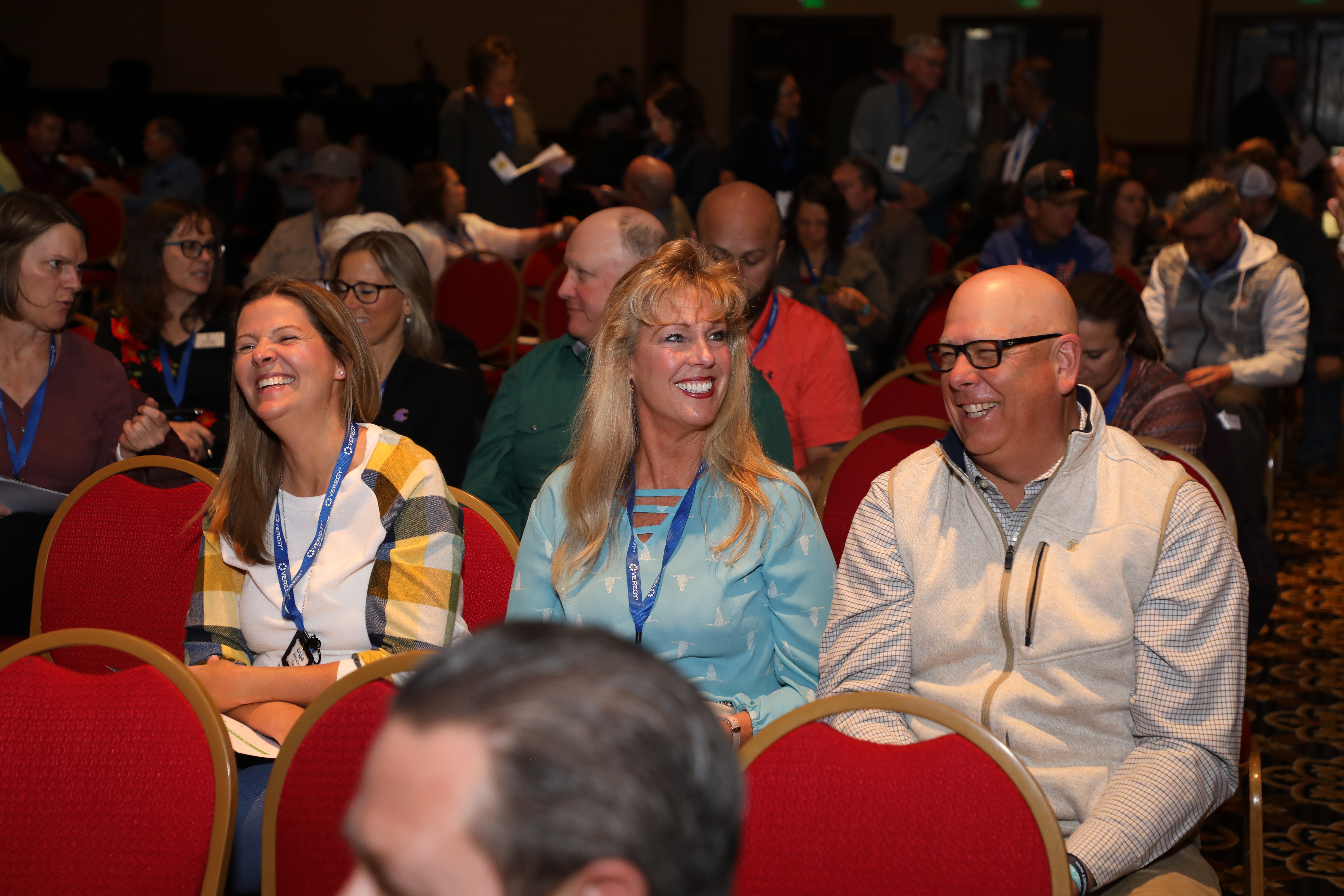Three teachers smiling at the CASB Convention.